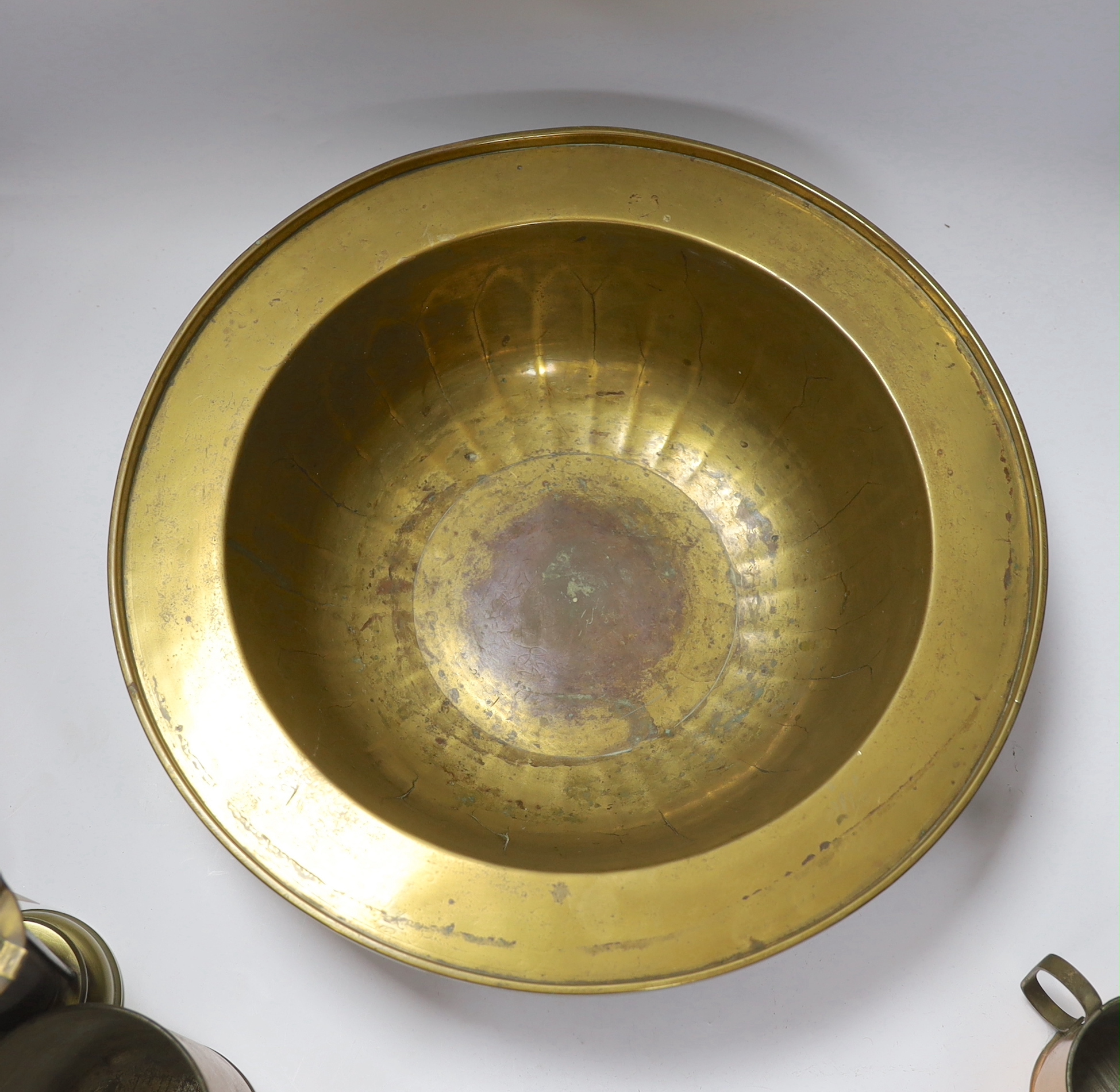 A miner's brass Davy lamp, signed E.Thomas & Williams, a large brass bowl and three graduated copper measures